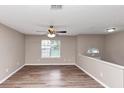 Bright and airy living room features modern floors, and neutral-colored walls at 5290 Forest Downs Ln, Atlanta, GA 30349