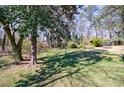 Lush backyard featuring mature trees and ample space for recreation at 141 Nathan Rd, Atlanta, GA 30331