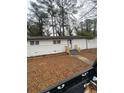 Charming single-story home with white brick and updated stairs at 1905 Robinhill Ct, Tucker, GA 30084