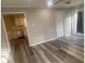 The Living Room has wood-look flooring and adjoins the kitchen at 1905 Robinhill Ct, Tucker, GA 30084