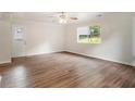 Spacious living room with hardwood floors and a window offering a view of the backyard at 3294 Renault Se Rd, Atlanta, GA 30354