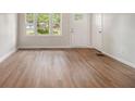 Bright and airy living room featuring beautiful hardwood floors and ample natural light at 3294 Renault Se Rd, Atlanta, GA 30354
