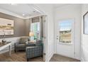 Well-lit office with comfortable seating and a view to the exterior of the home at 379 Morgan Rd, Carrollton, GA 30116