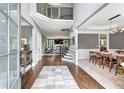 Spacious foyer with hardwood floors, high ceilings, and a staircase leading to the upper level at 4045 Bridle Ridge Dr, Suwanee, GA 30024