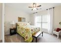 Bright bedroom features carpeted floors, large window, and neutral decor at 5744 Cypress Bluff Ln, Hoschton, GA 30548