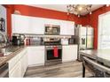Modern kitchen boasting stainless steel appliances and granite countertops at 9155 Nesbit Ferry Rd, Alpharetta, GA 30022