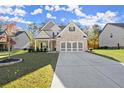 Attractive home with well-kept lawn, modern gray garage door and brick accents at 1511 Arica Ave, Lawrenceville, GA 30043