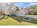 Charming home showcasing manicured lawn and modern gray garage door at 1511 Arica Ave, Lawrenceville, GA 30043