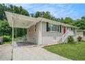 A lovely single-story home with attached carport and well-manicured lawn at 3204 Robin Rd, Decatur, GA 30032