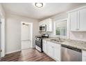 Bright kitchen featuring updated appliances, granite countertops, and ample cabinet space at 3204 Robin Rd, Decatur, GA 30032