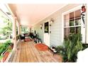 Inviting covered porch with ample seating area, plants and decor at 3320 Bryant Ln, Marietta, GA 30066