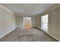 Inviting living room featuring neutral paint and plush carpet at 4397 Windsor Oaks Cir, Marietta, GA 30066