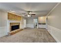 Cozy living room with a brick fireplace, neutral paint, and plush carpet at 4397 Windsor Oaks Cir, Marietta, GA 30066