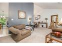 Bright living room boasting high ceilings, neutral walls, and a mix of stylish furnishings for a cozy yet elegant ambiance at 4865 Fenbrook Dr, Stone Mountain, GA 30088