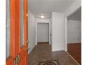 Welcoming home foyer featuring tile flooring and a glimpse of the interior layout at 100 Hall Pl, Fayetteville, GA 30215