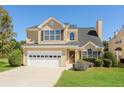Charming two-story home with a well-manicured lawn and attached two car garage at 2447 Stancrest Ln, Lawrenceville, GA 30044