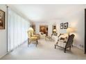 Bright living room featuring neutral-toned furniture, large windows, and an open layout at 5170 Oxbow Rd, Stone Mountain, GA 30087