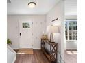 Welcoming entryway with wood floors, stylish console table, and coat hooks at 1857 Barrington Ct, Marietta, GA 30066
