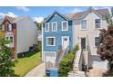 Charming two-story home with unique blue siding and inviting staircase entrance at 1857 Barrington Ct, Marietta, GA 30066
