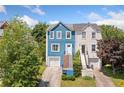 Charming two-story home with unique blue siding and inviting staircase entrance at 1857 Barrington Ct, Marietta, GA 30066