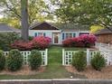 Home exterior with green lawn and azalea bushes at 220 Sisson Ne Ave, Atlanta, GA 30317