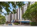 Luxury high-rise condo building featuring multiple balconies and a beautifully designed entrance at 1130 Piedmont Ne Ave # 803, Atlanta, GA 30309
