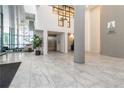 Modern condo lobby with marble floors, high ceilings, and large windows offering plenty of natural light at 1130 Piedmont Ne Ave # 803, Atlanta, GA 30309