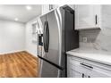 New stainless steel refrigerator and modern white cabinets enhance this kitchen space at 1150 Rankin St # 6H, Stone Mountain, GA 30083
