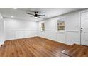 Spacious living room featuring laminate flooring, crisp white walls, and natural light at 1150 Rankin St # 6H, Stone Mountain, GA 30083