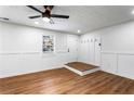 Bright living room with modern ceiling fan, wood-look floors, and updated trim at 1150 Rankin St # 6H, Stone Mountain, GA 30083