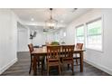 Bright dining room with a wooden table and chairs, adjacent to the living room for open-concept living at 1285 Avon Sw Ave, Atlanta, GA 30310
