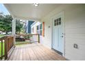 Inviting front porch with wood flooring and a light blue front door, offering a cozy entryway at 1285 Avon Sw Ave, Atlanta, GA 30310