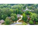 An aerial view of a beautiful home surrounded by lush greenery and mature trees in a peaceful neighborhood at 2695 Rangewood Ne Dr, Atlanta, GA 30345