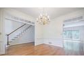 Elegant dining room with hardwood floors, crown molding, and a chandelier, perfect for hosting gatherings at 2695 Rangewood Ne Dr, Atlanta, GA 30345