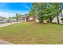 Attractive one-story home on a grassy lot, featuring a two-car garage and brick facade at 3035 Landington Way, Duluth, GA 30096