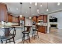 Kitchen with granite countertops, stainless steel appliances and bar stool seating at 149 Stargrass Way, Grayson, GA 30017