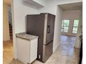 Kitchen featuring stainless steel refrigerator and granite countertops at 2565 Terrace Trl, Decatur, GA 30035