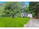 Well-manicured front yard with lush lawn and mature trees, offering ample space at 1091 Napier Se St, Atlanta, GA 30316