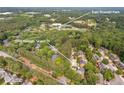 Aerial view of the neighborhood with lush greenery, proximity to East Roswell Park, and convenient residential living at 1995 Raleigh Tavern Dr, Roswell, GA 30076