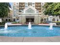 Luxurious building entrance with water feature and manicured landscaping at 795 Hammond Dr # 505, Atlanta, GA 30328