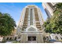 High-rise condominium featuring terraces, a grand entrance, and beautiful landscaping at 795 Hammond Dr # 505, Atlanta, GA 30328