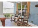 Inviting front porch with rocking chairs, perfect for relaxing and enjoying the neighborhood at 230 Ryan Ln, Covington, GA 30014