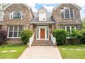 Charming stone home featuring a front entrance with stone steps and mature landscaping in a desirable neighborhood at 355 Clark Creek Pass, Acworth, GA 30102