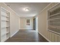 Bright room with new gray vinyl flooring, fresh paint, built-in shelves, and natural light at 1906 Oak Valley Rd, Decatur, GA 30035