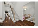 Bright foyer leading to living spaces, with stairs, hardwood floors and an open floorplan at 237 Arborview Dr, Mcdonough, GA 30252