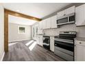 Modern kitchen with white cabinetry, granite countertops, and stainless steel appliances at 2968 Cleburne Pkwy, Powder Springs, GA 30127