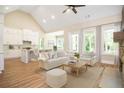Bright and airy living room with vaulted ceilings, fireplace, and abundant natural light at 1150 Sweet Mia Ln, Powder Springs, GA 30127