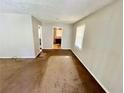 Empty living room with gray walls and visible floors with a window for natural light at 1292 Lorenzo Sw Dr, Atlanta, GA 30310