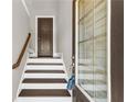 Entryway with hardwood stairs and view of the front door at 1547 Cambridge Pl, Marietta, GA 30062