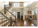 Grand foyer with hardwood floors, staircase, and elegant architectural details at 280 Selkirk Ln, Johns Creek, GA 30097